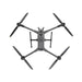 Black drone with four propellers on a white background