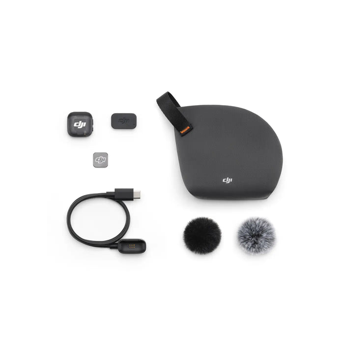 Collection of DJI accessories including a case, microphone, and cables on a white background