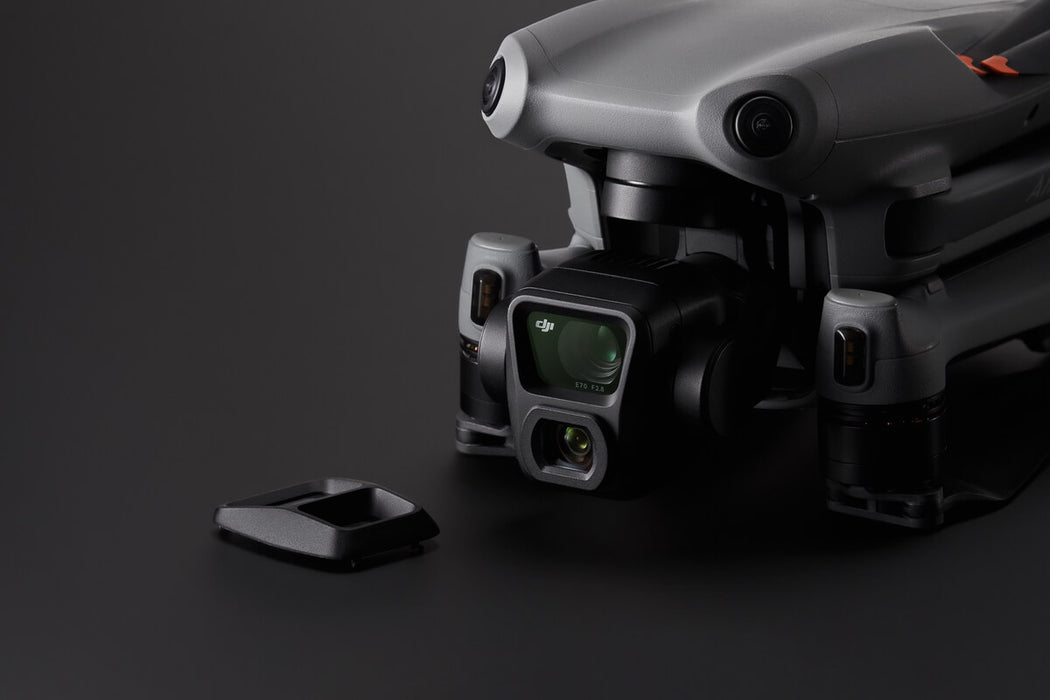 Gray drone with camera on a dark background
