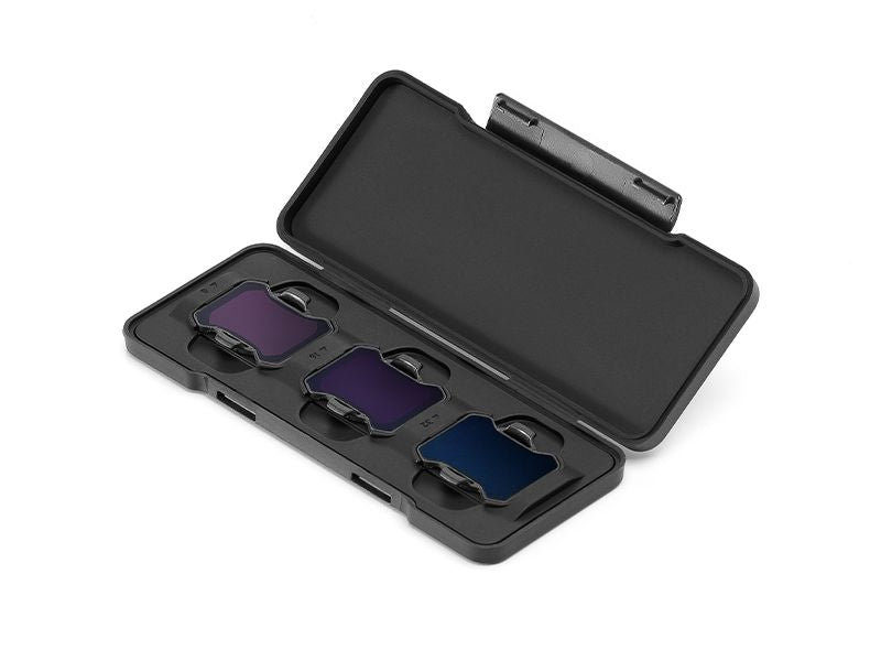 Black case with three lens filters inside on a white background