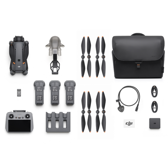 Collection of drone parts and accessories including propellers, battery, remote control, and carrying case on a white background.