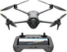 Drone with four propellers and a remote control on a white background