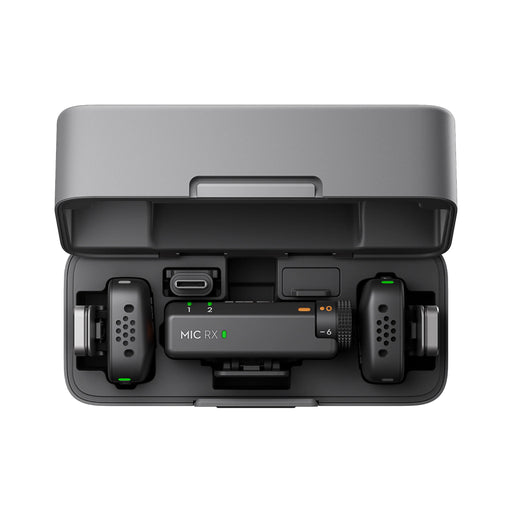 Black electronic device with 'MIC RX' on a white background