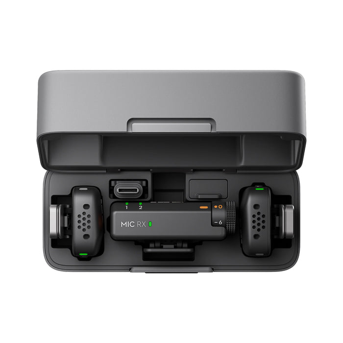 Black electronic device with 'MIC RX' on a white background