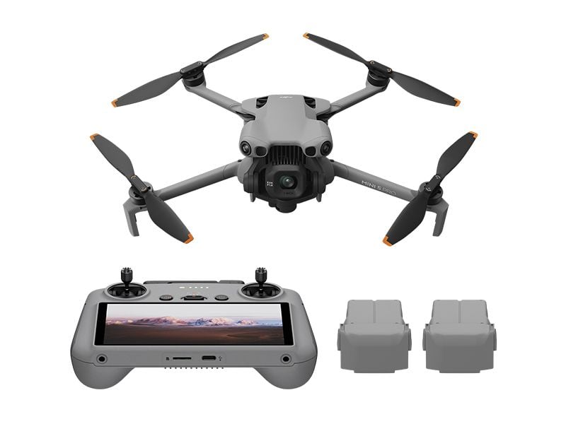 Drone with remote control and batteries on a white background