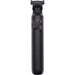 Black camera remote control with buttons on a white background