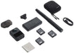 Collection of black electronic devices and accessories on a white background