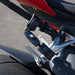 Close-up of a motorcycle handlebar with red and black accents.