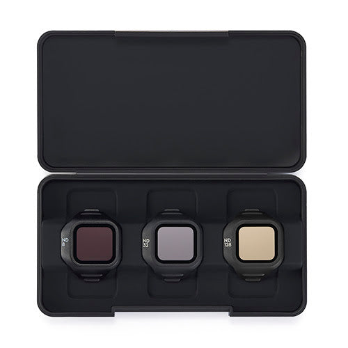 Three camera filters in a black carrying case on a white background